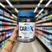 Close-up of (Applied Nutrition Carb X 300g) held up inside My Supplement Shop, clearly showing the front label in a Sports Nutrition setting.