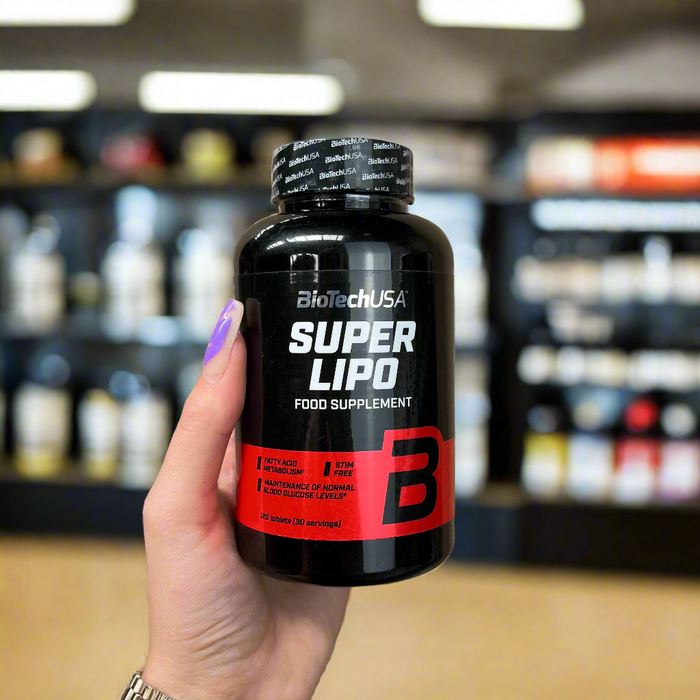 Close-up of (BioTechUSA Super Lipo) held up inside My Supplement Shop, clearly showing the front label in a Sports Nutrition setting.