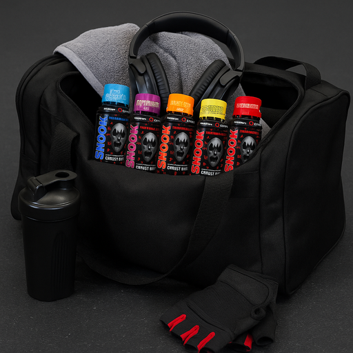Black gym bag on a gym floor with a grey towel, black headphones, shaker bottle, and red-accented gloves, featuring all flavours of Murdered Out Shook Energy Shot bottles – lifestyle scene with subtle MySupplementShop-inspired colour touches.