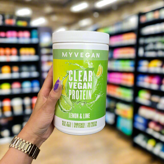 Close-up of (MyProtein MyVegan Clear Vegan Protein 320g) held up inside My Supplement Shop, clearly showing the front label in a Sports Nutrition setting.